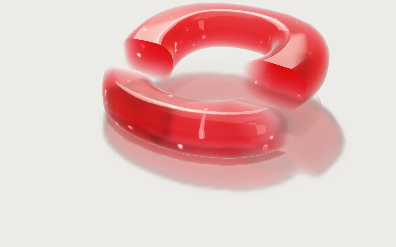 An O in Mona Sans, cut through and lifted: the cut faces flat and bright, the moulded edges round